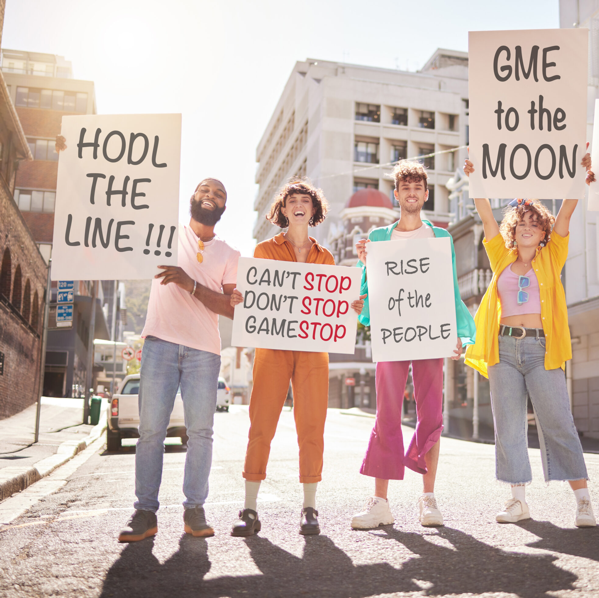 photo of several people ion the street holding some