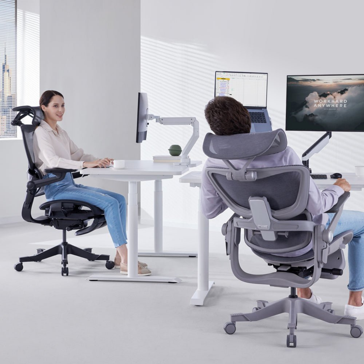 Image of two people in office in ergonomic chairs